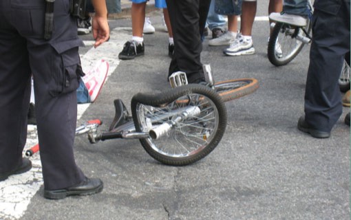 photo of a mangled bicycle after a crash with a car