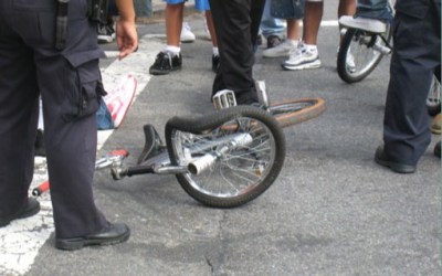 photo of a mangled bicycle after a crash with a car