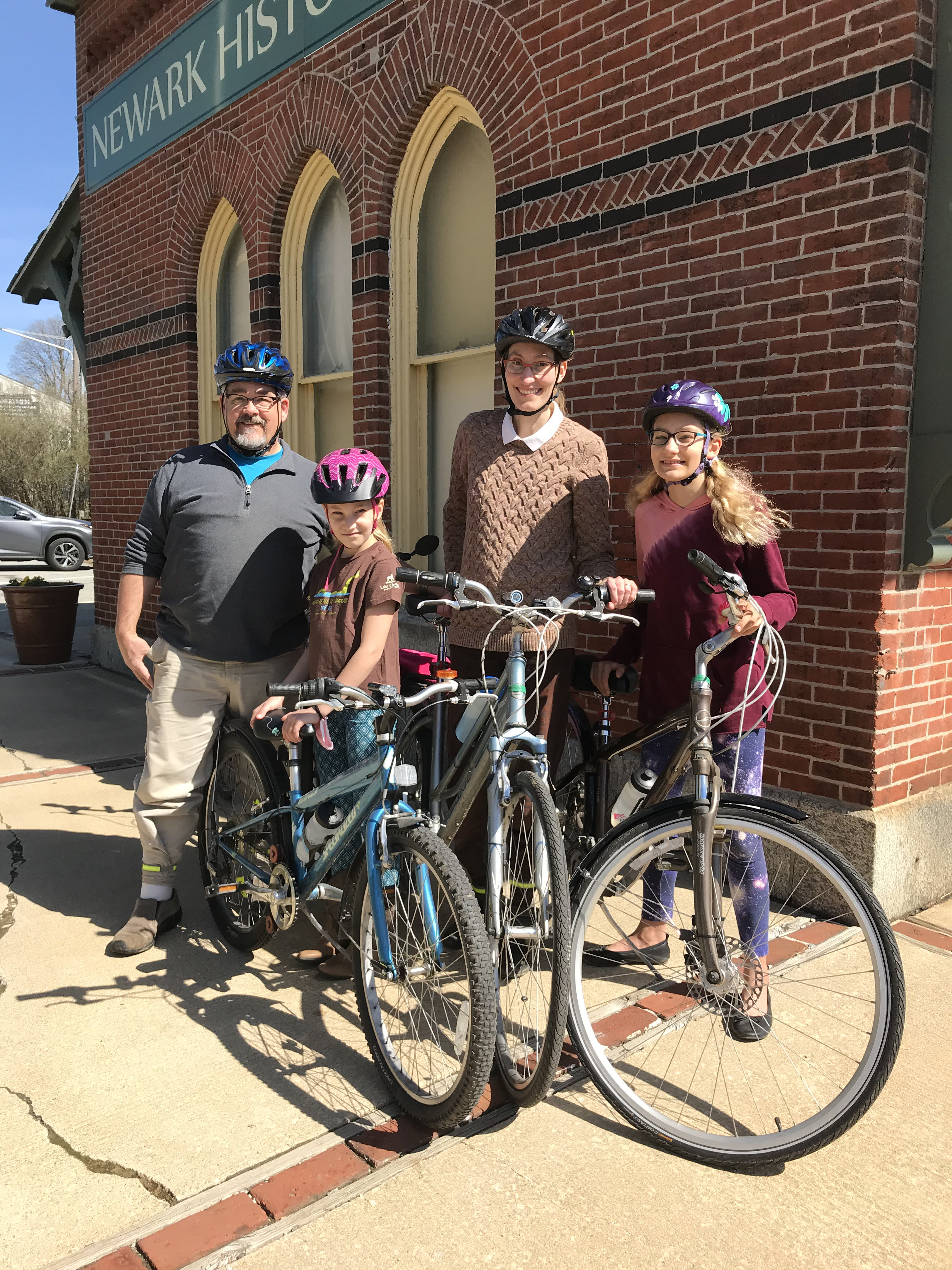 photo of family with bikes