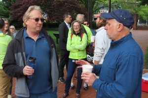 Karl Hassler and or Stu Markham talking with others in the background
