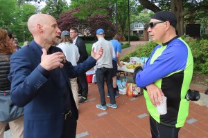James Wilson and Sen. Dave Sokola talking with others in the background