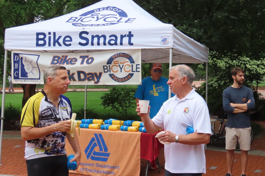 photo of DelDOT tent with Lou Rossi and Karl Hassler in foreground
