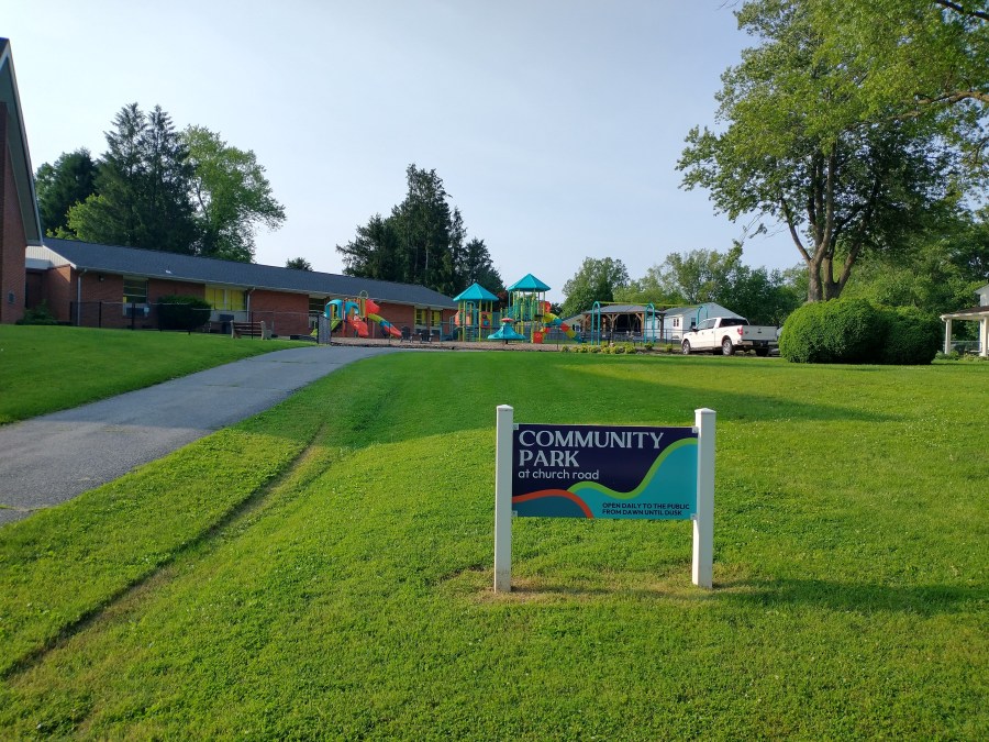 The Community Park at Church Road, with the park sign in the foreground.