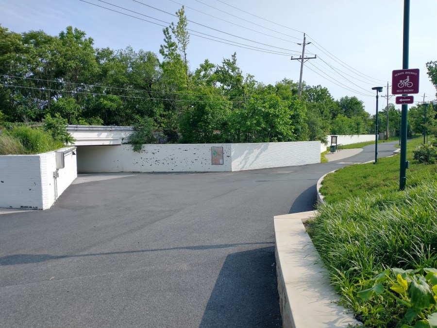 The paved trail and railway underpass at Hillside Park.