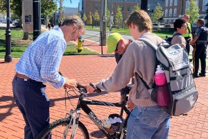 photo of Dave Schultz and Mark Deshon installing bike lights